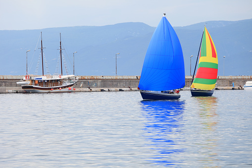 Two sailboats entering the port of Rijeka, Croatia
