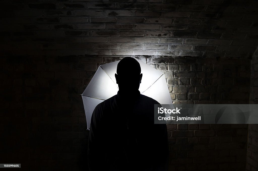 mystery person silhouette Back Lit Stock Photo