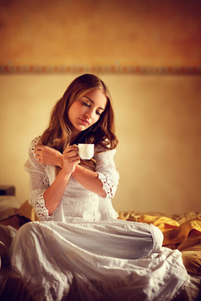 istock girl drinking coffee in bed 155599713