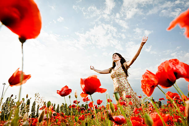 istock Young woman with spread arms looking up 155599882