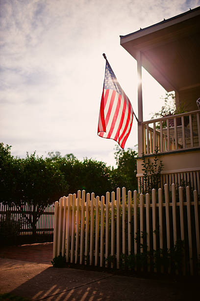 istock American Flag on a rural house 155599923