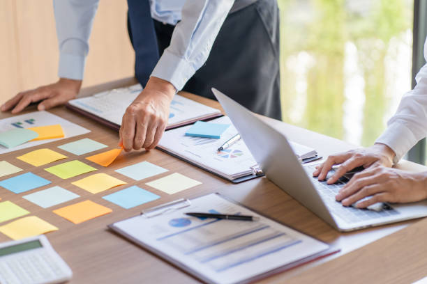 istock Business People brainstorming Meeting Design Ideas use post it notes to share idea professional investor start up project business brainstorming planning in office 1556004415