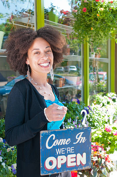 istock Woman with Open Sign 155600544