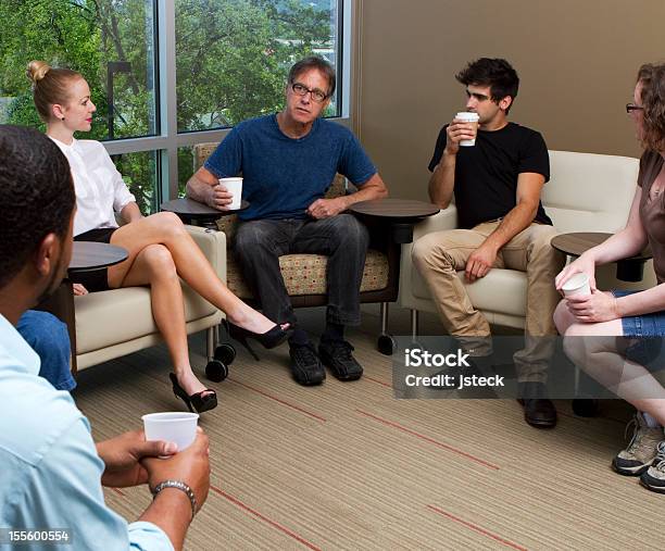 Counselor Assisting With Group Therapy Stock Photo - Download Image Now - Group Of People, Mature Adult, Psychotherapy
