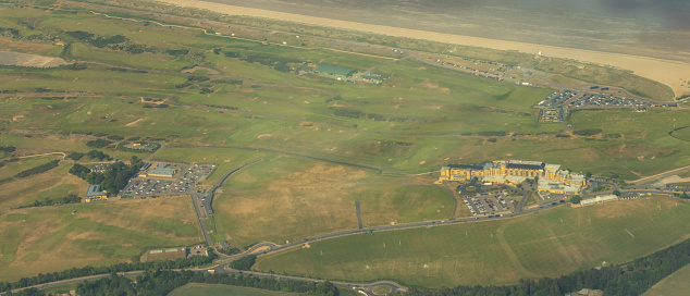 A golf course seen from an aircraft view above.