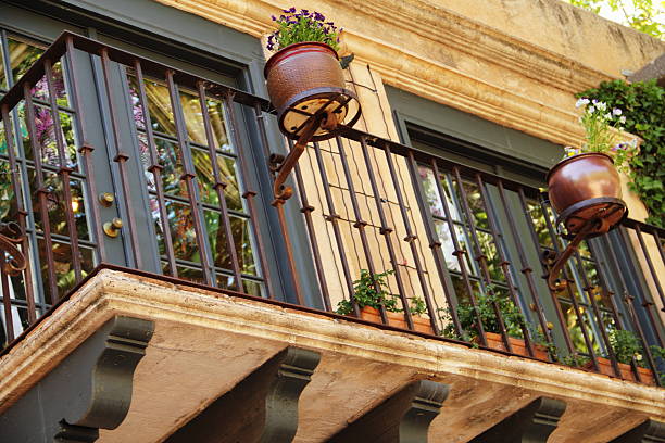 Spanish style balcony with french doors.