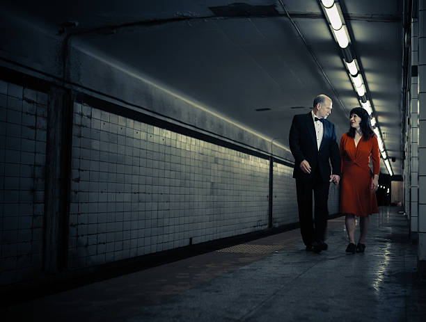 istock elegant couple walking 155600965