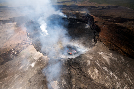 Aerial view of Pu'u O'o crater on the Big Island of Hawaii, June 2012.  Although the crater was relatively inactive at this time, the bubbling lava can be seen inside a smaller area of the immense crater.