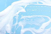 Foam on blue motorhood background