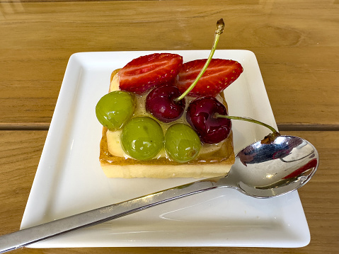Fruit tart dessert cake with spoon