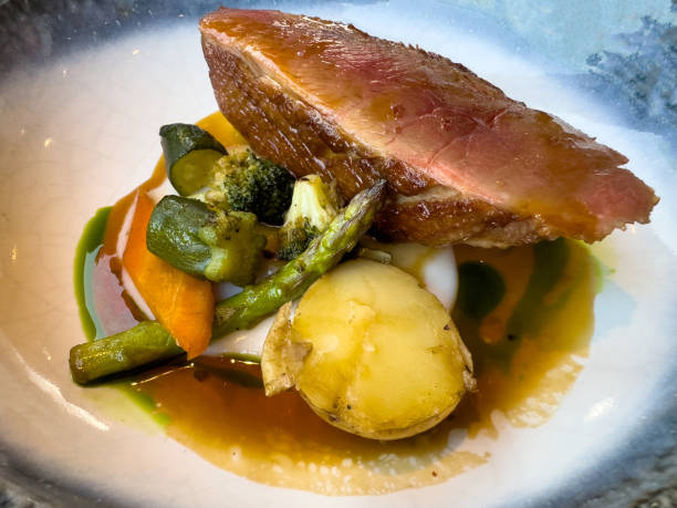 istock Chinese duck breast fillet with vegetables 1556014293