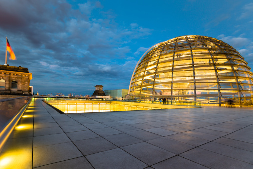 Outside the illuminated Reichstag Dome at Twilight. Spiral walkways to the top of the Reichstag, Germany's parliament building in the heart of Berlin, Central Berlin, Germany.