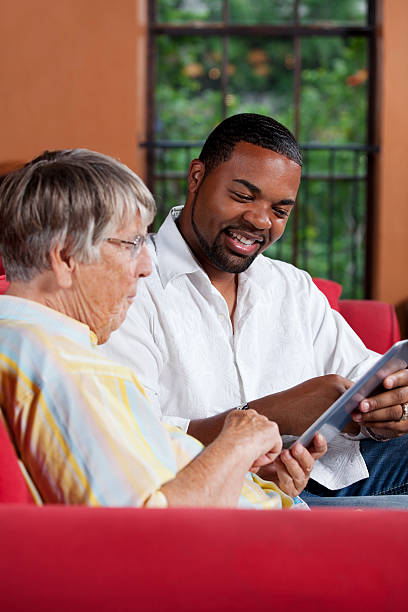 istock Social worker explaining something to a senior woman 155601797