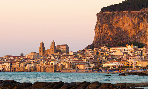 Beach and old town of Cefalu in the light of sunset