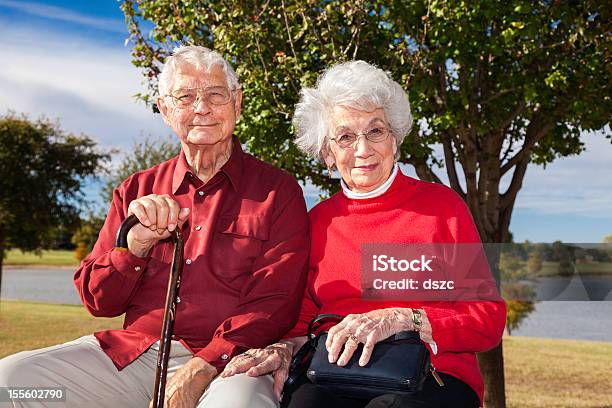 Senior Couple Outside In Park Stock Photo - Download Image Now - Senior Couple, Lake, Smiling
