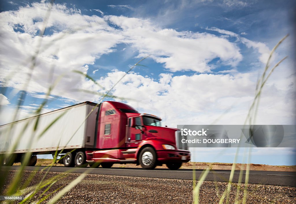 Trucking Semi diesel truck in motion on highway Highway Stock Photo