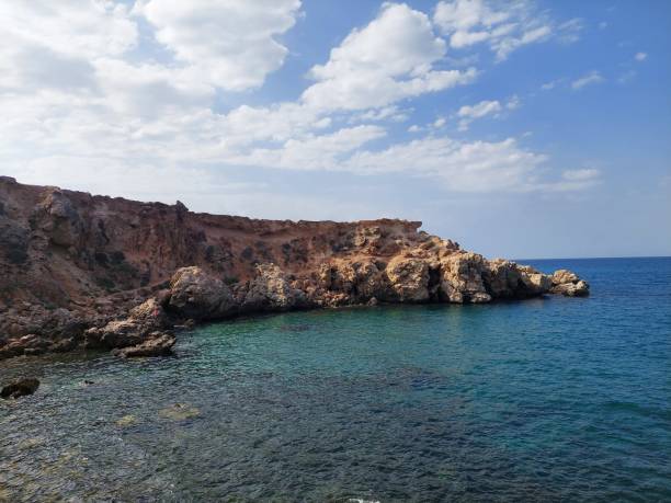 istock Summer's Embrace: The Enchanting Sea and the Curving Mountain 1556045849