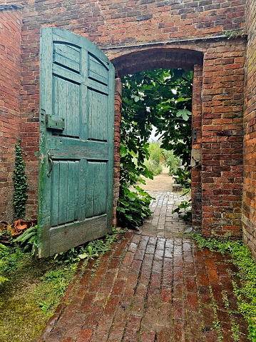 Open green door to a secret garden