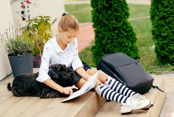 Back to school. Cute child girl with backpack going to school