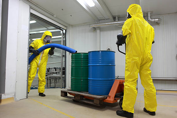 istock two professionals in uniforms dealing with chemicalss 155606347
