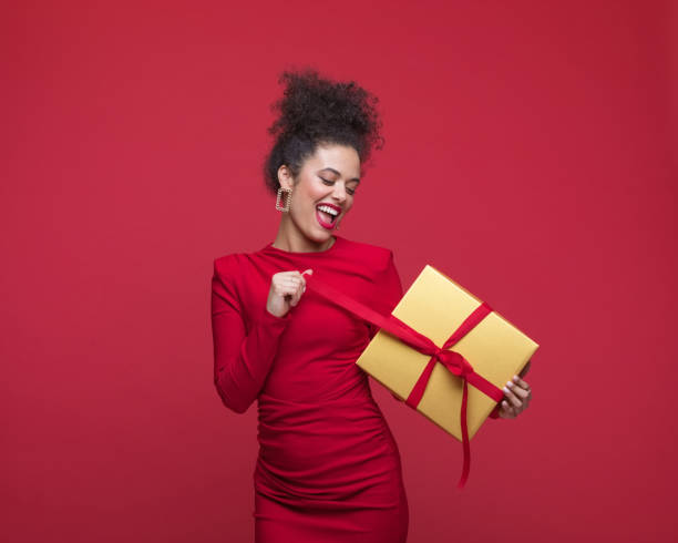 istock Beautiful woman celebrating xmas 1556074125