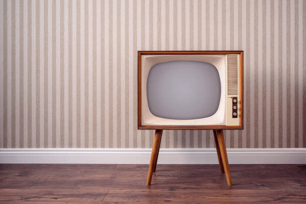 Retro TV set in empty room Retro TV set in empty room with copy space old television stock pictures, royalty-free photos & images