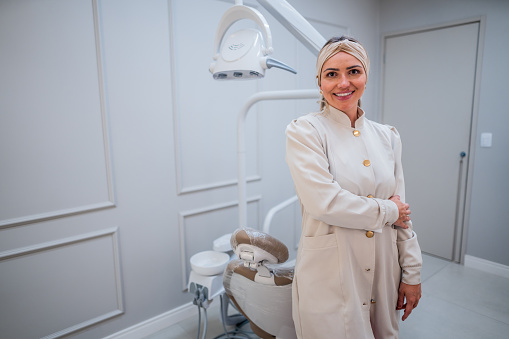 Portrait of a mid adult woman dentist at dentist's office