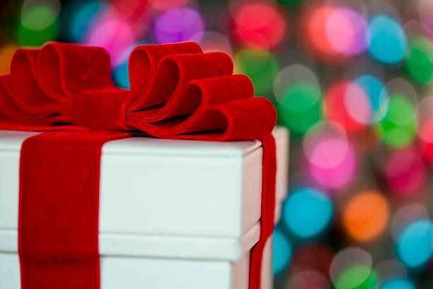 A Christmas gift on defocused lights.
