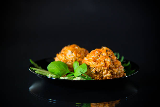 istock Cooked meatballs in a plate with fresh vegetables 1556160659