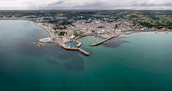 Aerial panorama landscape of the Cornish coast town of Penzance from the ocean with harbour and Jubilee swimming pool and copy space