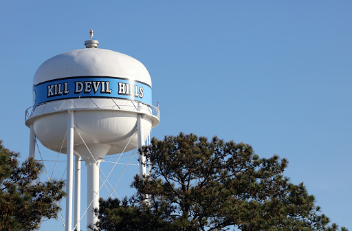 Kill Devil Hills, NC, USA - March 6, 2023: A water tower in Kill Devil Hills, North Carlina. Kill Devil Hills is a town in Dare County, North Carolina.