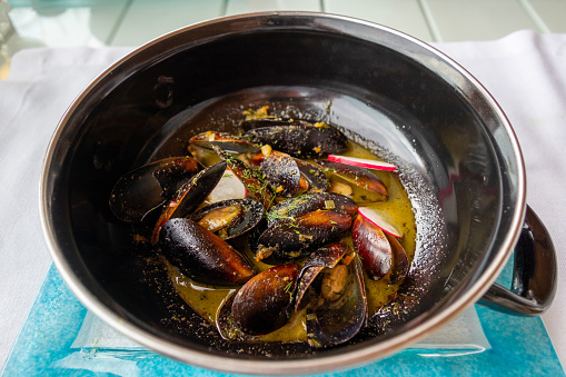 A serving of steamed mussels - moules mariniere