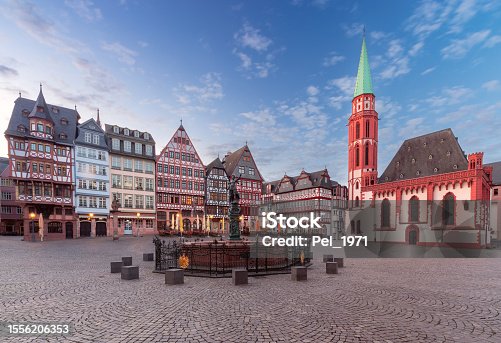 istock Old medieval houses on the market square in Frankfurt am Main at dawn. 1556206353