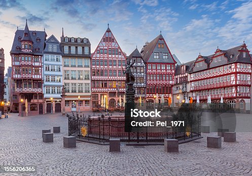istock Old medieval houses on the market square in Frankfurt am Main at dawn. 1556206365