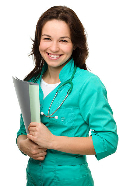 Young attractive woman wearing a doctor uniform stock photo