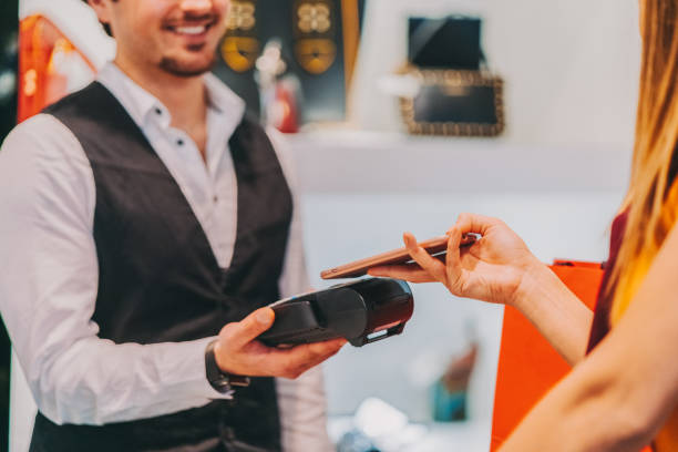 istock Contactless payment in the mall 1556214724