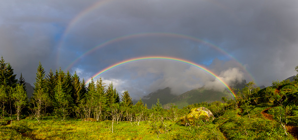 Full rainbow over countryside lansdcape