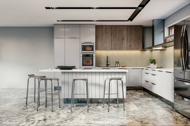 istock Modern large white and hardwood kitchen with rectangular white granite and hardwood breakfast kitchen island with stools 1556228008
