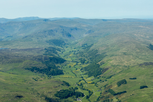 The view from a drone of a small Scottish river and waterfall after heavy rain the location is in Dumfries and Galloway south west Scotland