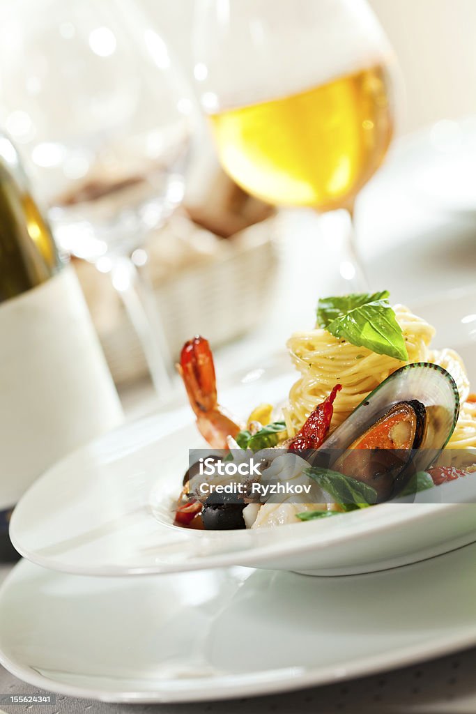 Seafood Spaghetti Seafood Spaghetti with Tiger Prawns, Scallops, Mussels, Calamari, Salmon and Tomato Sauce Gourmet Stock Photo