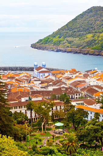 Panoramic cityscape, garden and historic district of Angra Do Heroísmo , Terceira island, Azores, Portugal. Monte Brasil  and seascape in the background.