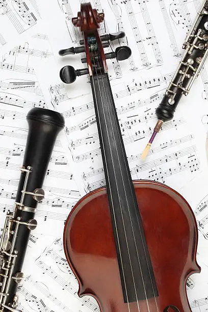 Classical musical instruments with music sheet. Violin oboe instrument of symphony orchestra. 