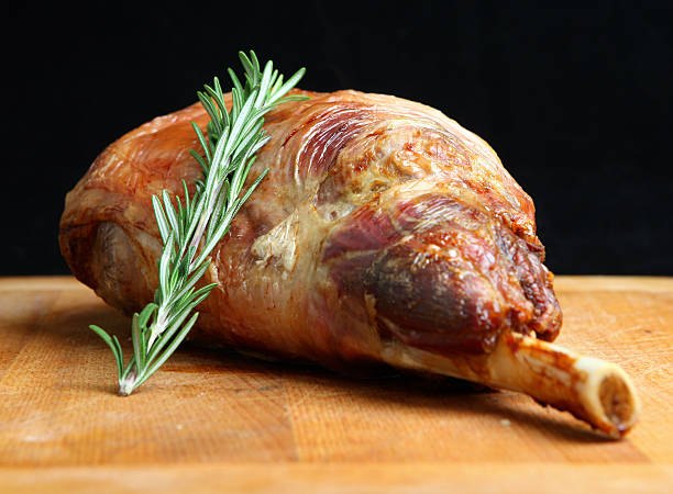 istock Roast leg of lamb with garnish 155628144