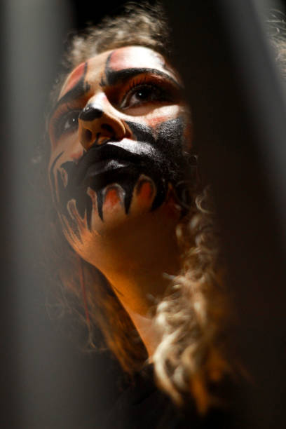 istock A woman with a halloween make-up looking away 1556286166