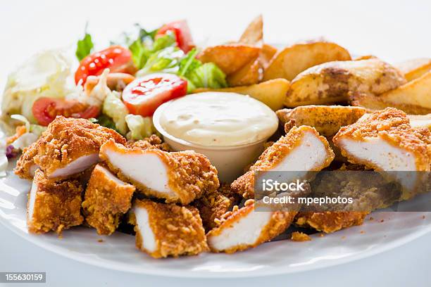 Chicken Nuggets With Country Potatoes Stock Photo - Download Image Now - Bright, Chicken - Bird, Chicken Breast