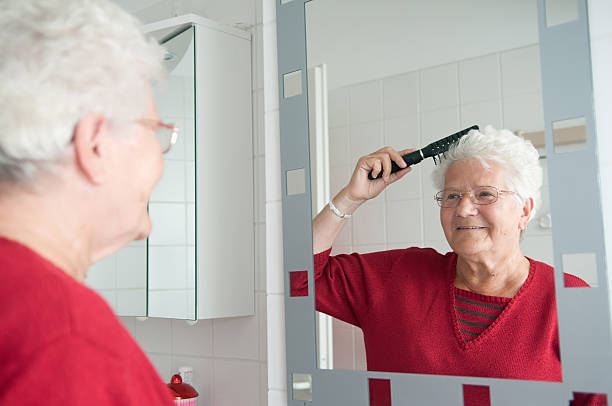 istock grandma is combing the hair 155630272