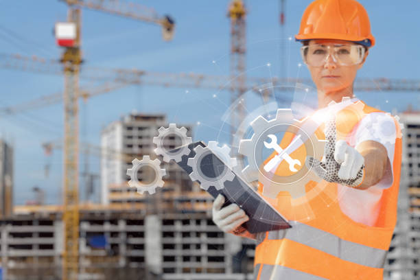 istock Builder in uniform clicks on the repair icon. 1556308384