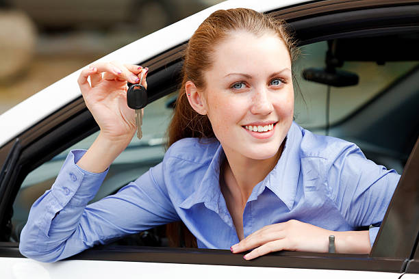 istock Female driver in a white car 155631112