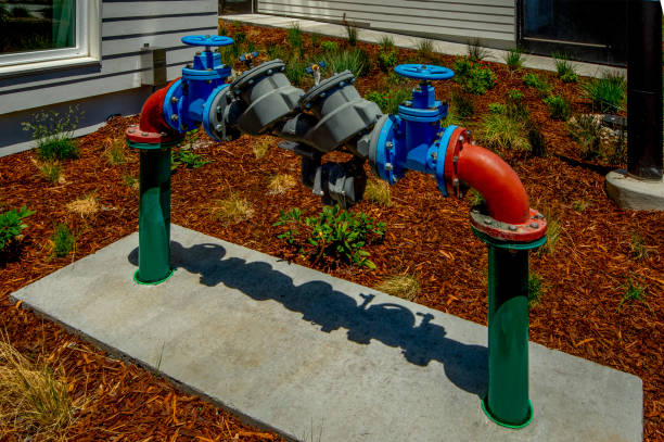 Water line input for an apartment building with back flow preventer and control valve.