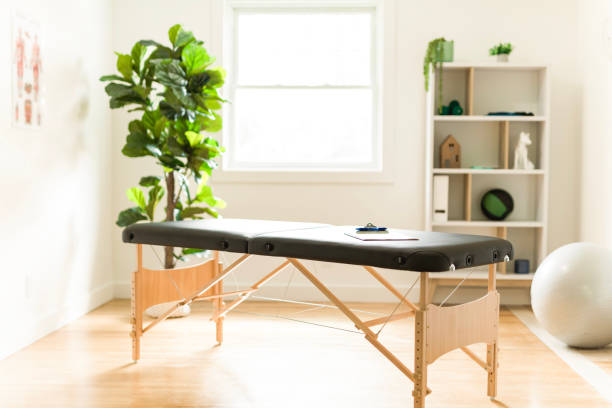 An Office of massage therapist in modern medical center Office of massage therapist in modern medical center alternative healthcare worker stock pictures, royalty-free photos & images